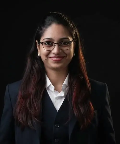 Reena facing the camera, smiling